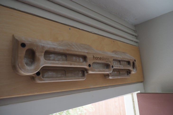 Tension honestone hanging in a doorwary with chalk on it