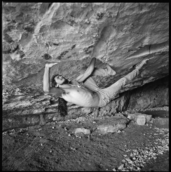Charles Albert climbs a steep crux of his new V17 boulder.