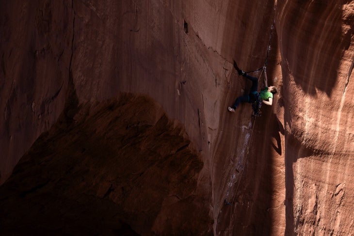 Lor Sabourin shakes out below a steep finger-crack crux on crack on Moab.