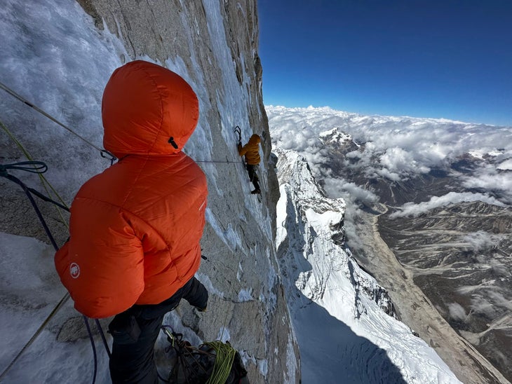 Rousseau belays Cornell as he leads out from a tension traverse to link sheets of ice at ~7,300m (24,000ft) on day five.