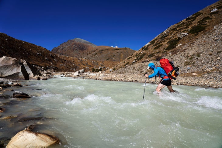 Fording one of many rivers enroute to Surma-Sarovar.