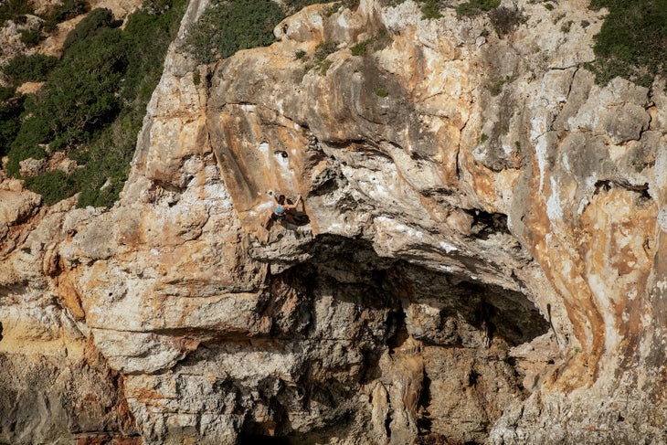 A climber deepwater soloing while competing on Chris Sharma's reality TV show 'The Climb'