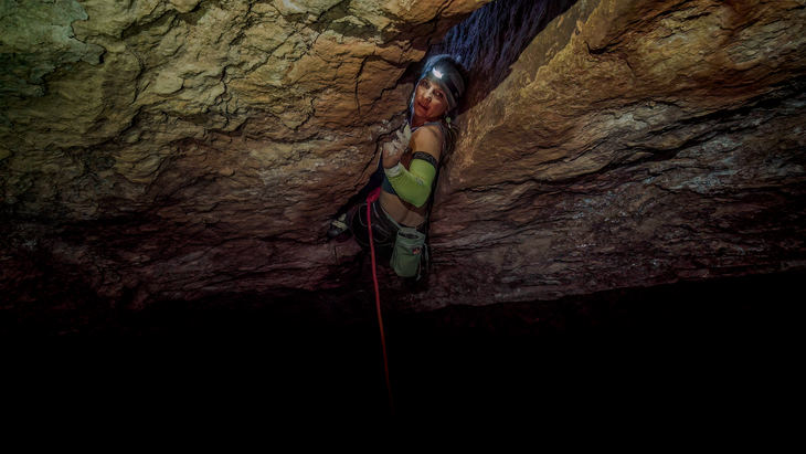Eden climbing in the dark on Black Mamba.