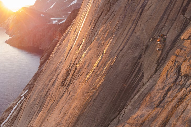 Wall camp about 600 meters up the 900-meter face on Qaersorssuaq. The team was trapped here by a three-day storm before the final push for the summit.