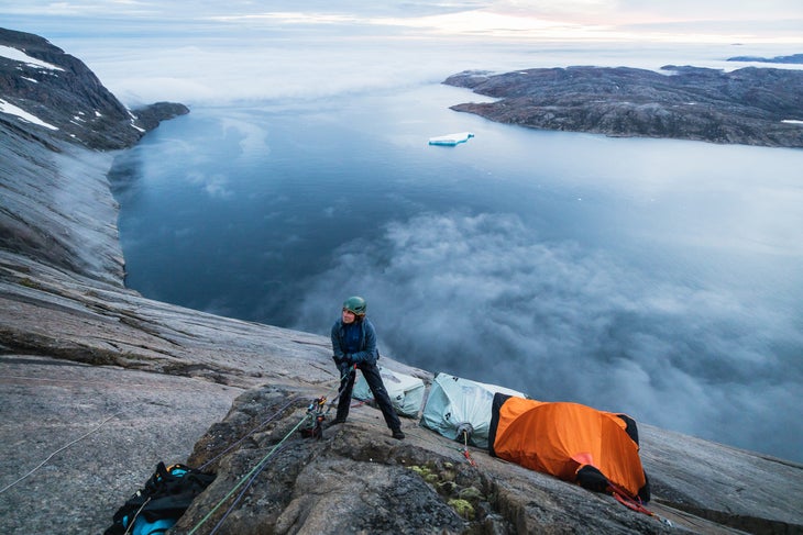 Bronwyn Hodgins scoping the upper wall from the portaledge camp on Qaersorssuaq.