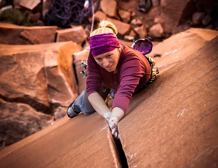 Meg O'Neill crack climbing in the desert