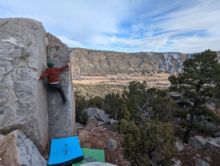 The author climbing a technical V3 dihedral.