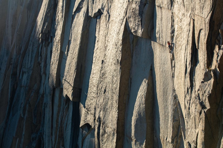 Harrington climbs the crux third pitch of Manchu Wok. The feature is deceptively steep, following an overhanging dyke system.