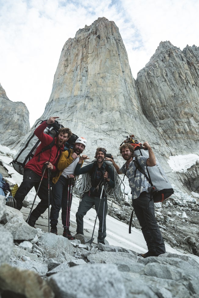 Nicolas Favresse, Siebe Vanhee, Sean Villanueva-O’Driscoll, and Drew Smith psyched below the East Face of Torre Central, Patagonia.