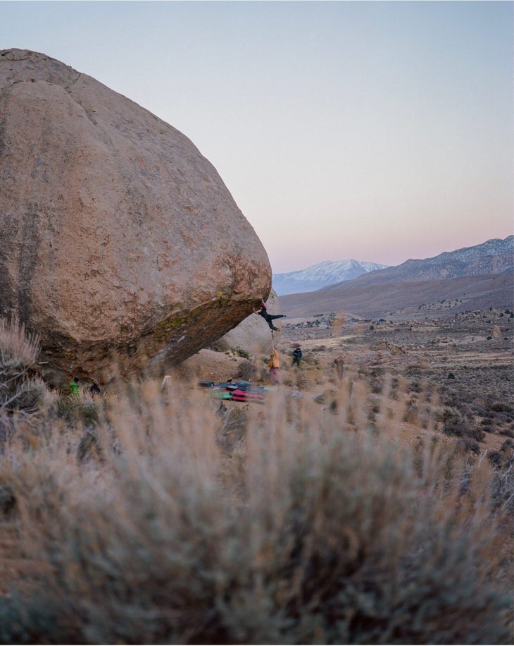 Zach Galla holding the swinging jump to the lip while sending The Process.