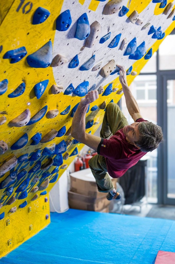 A climber on the 2024 MoonBoard