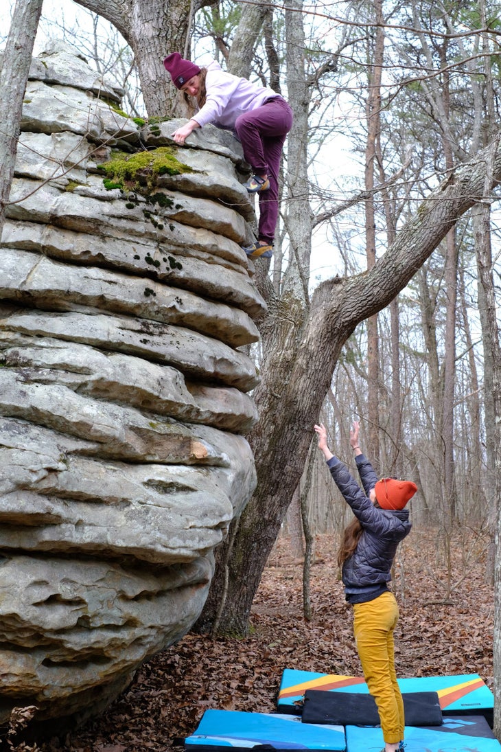 A woman climbing an immaculate series of horizontal sloping sandstone rails at the Citadel.