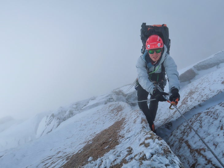 Luka Lindič emerges from a snowy bivy to climb the last meters to the summit on Pot, a new route on Poincenot in Patagonia.
