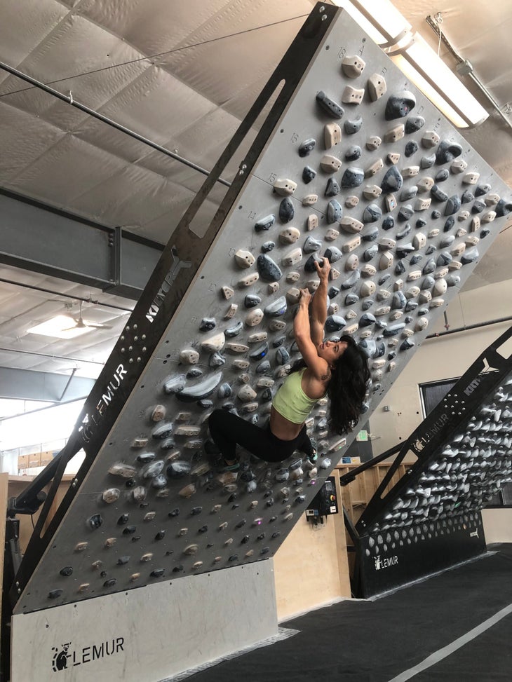Pro climber Nina Williams climbing on the 12 x 8 foot Tension Board 2
