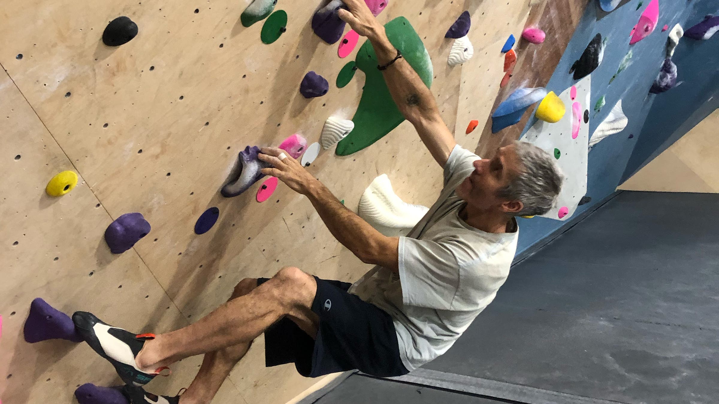 Climbing gear tester Matt Samet tests the La Sportiva Mantra shoe on a gym rock wall