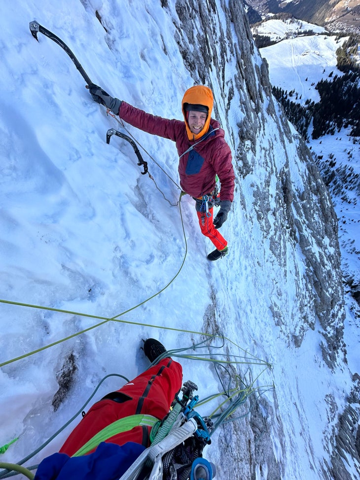 Free solo climber Martin Feistl climbs an ice pitch during a first ascent in the Italian Dolomites.