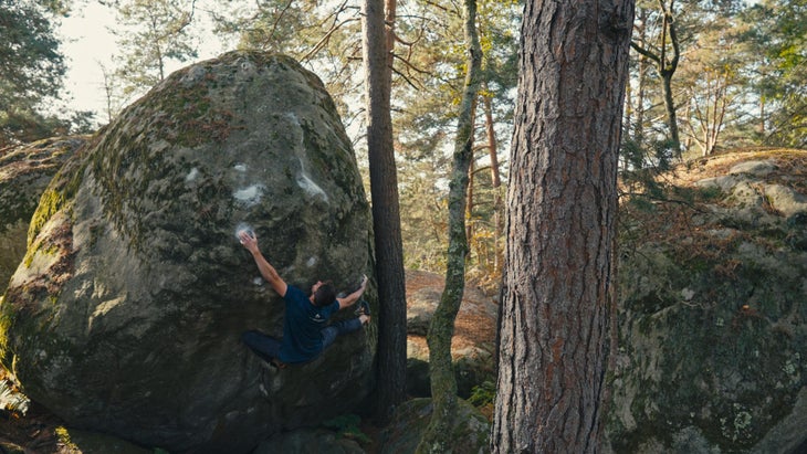 YouTuber Sam Lawson doing his favorite boulder problem, a V11 in the forest of Fontainebleau