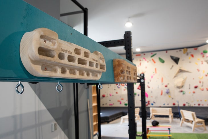 Two climbing hangboards in an empty climbing gym