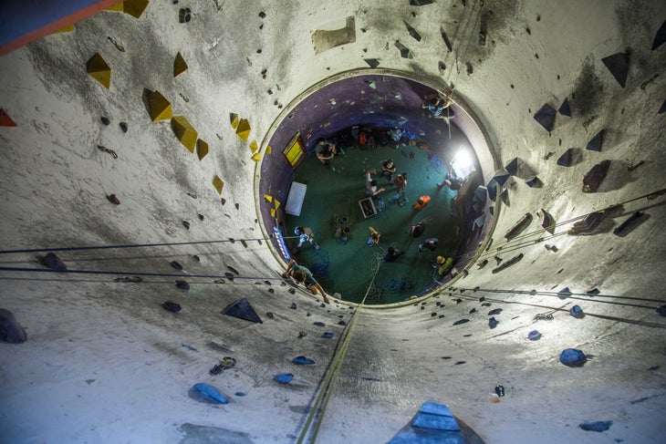 Climbers inside an old cement silo at Parque de Escalada Los Silos