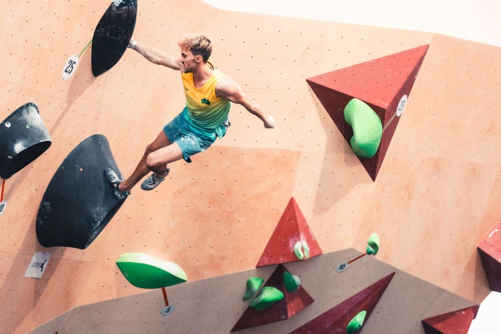 Olympic climber Campbell Harrison competes in an indoor climbing competition for Australia.