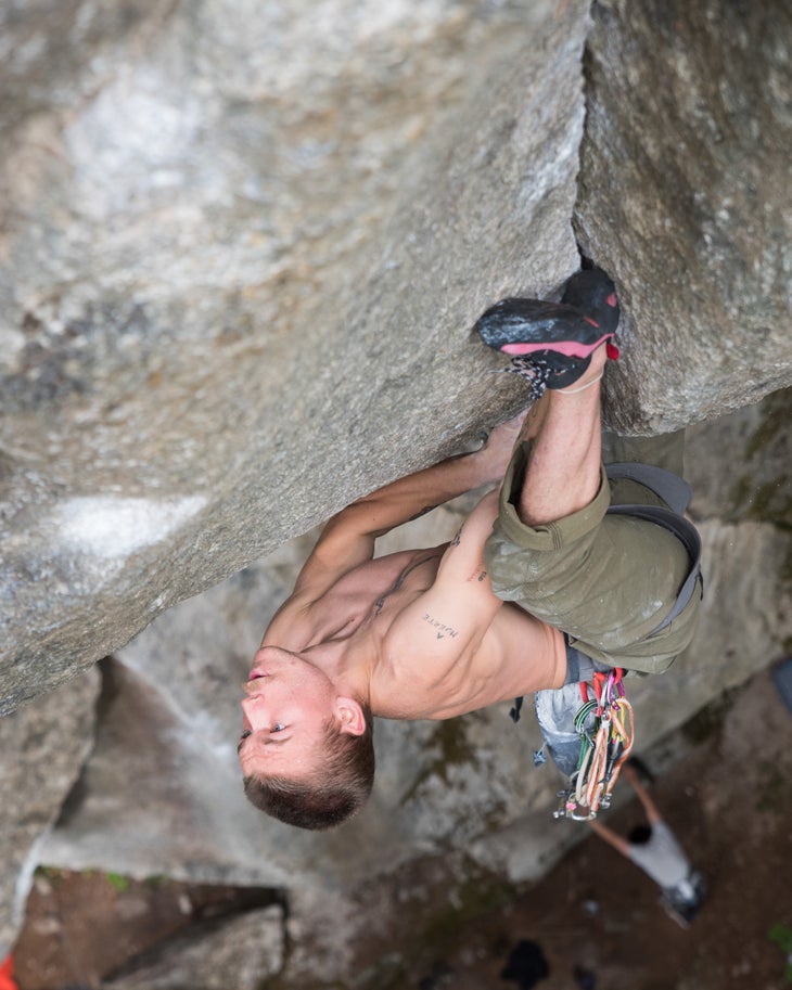 Nat Bailey heel hooks above his head on Cobra Crack, in Squamish, BC.