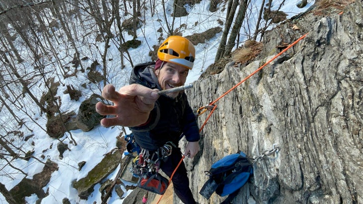 Climber Lee Hansche replaces bolts at Rumney.