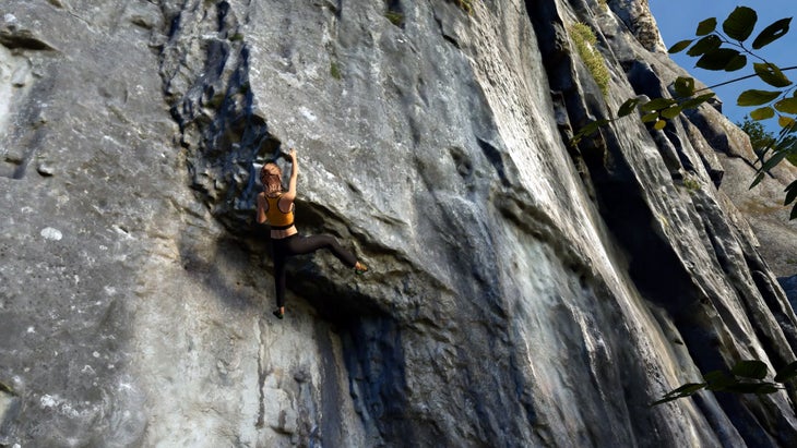 Avatar woman climbs digital cliff line.