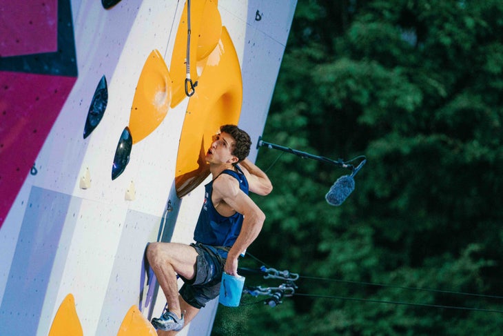 Olympic climber Jesse Grupper working hard on an IFSC World Cup lead route in 2022