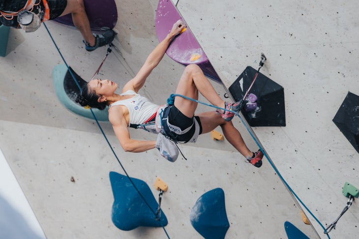 A woman sport climbing