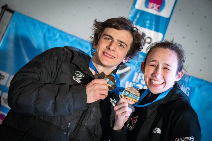 Emma Hunt and Sam Watson posing with medals after a competition.