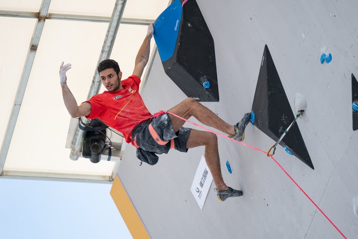 A Spanish climber celebrating at the top of the Lead route during the Olympic Qualifier Series in Shanghai.