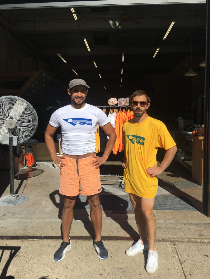 A humorous photo of Acevedo (a big guy) wearing a very small GP81 shirt while Simanski (a small guy) wears a very large one.