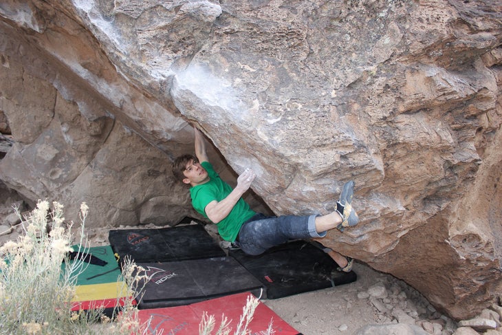 The author climbs overhanging boulder in Bishop, CA.