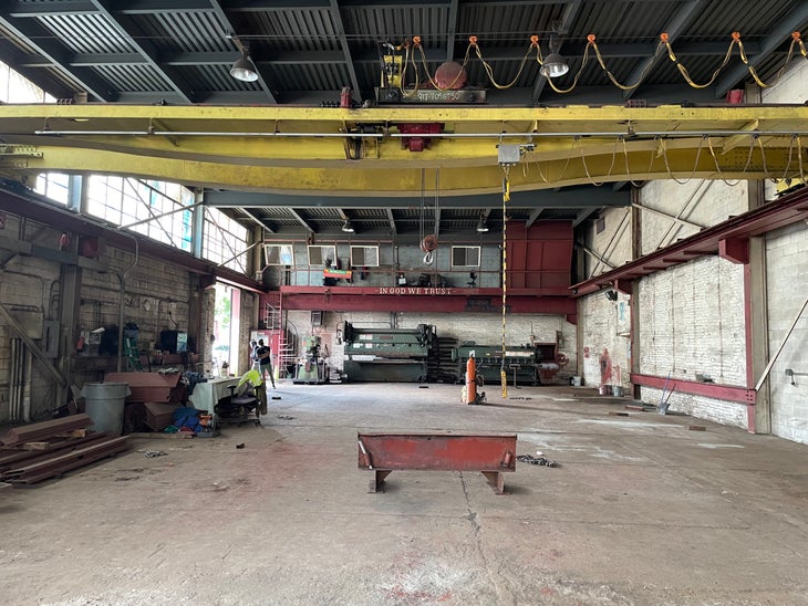 GP81 on move-in day, with bits of industrial debris all over the warehouse floor and walls.