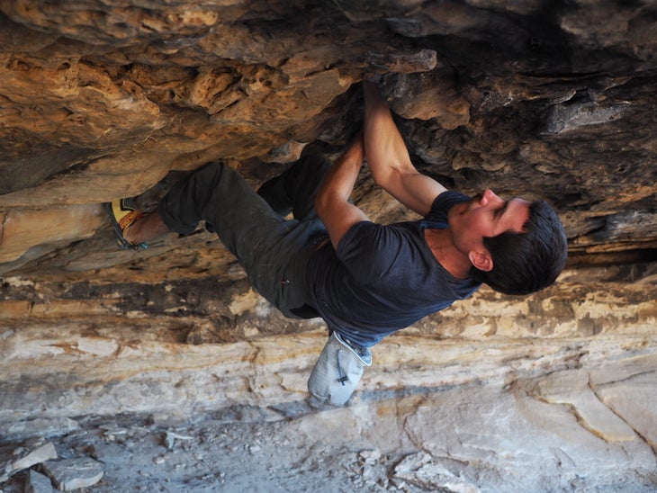 The author climbing on a roof