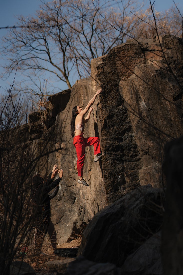 Sunna climbing Cat Arete (v0+) in Central Park, New York, NY