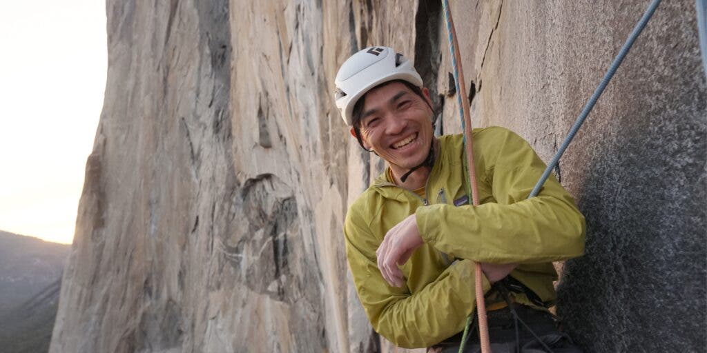 Keita Kurakami smiles partway up El Capitan, Yosemite, in 2023.