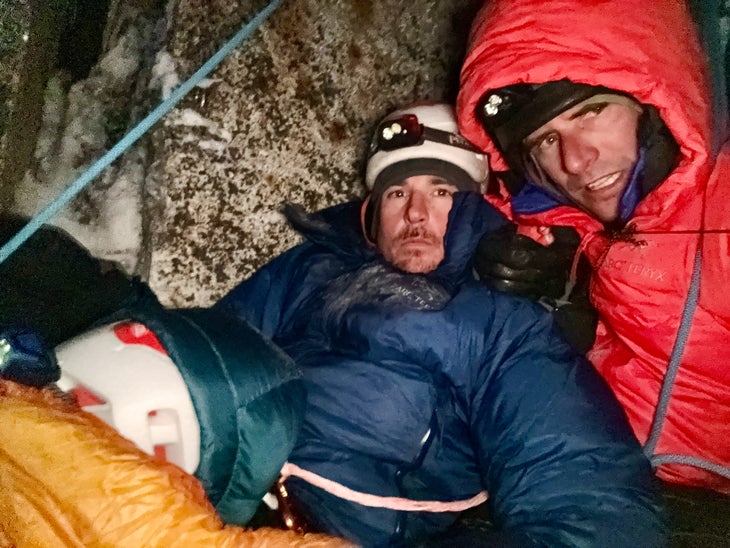 Tucking in for the night in -10 F temps at the Bobsled Bivy on Mount Hunter's East Face.