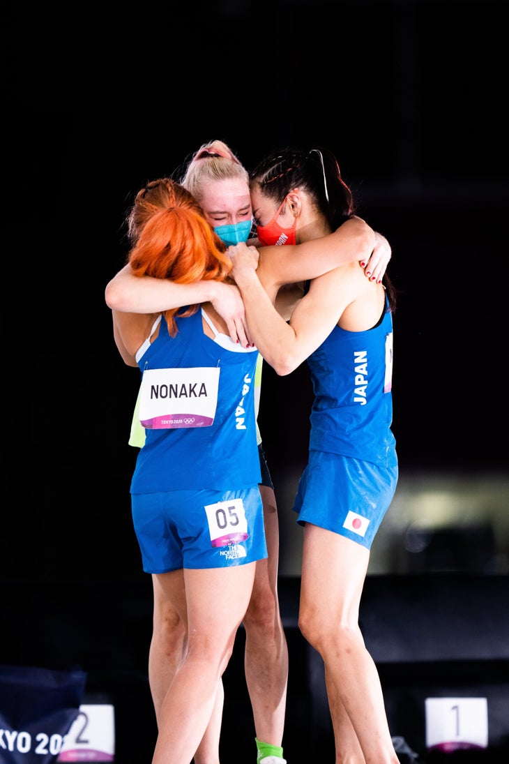 The famous photograph from the Sport Climbing event of 2021 Toyko Olympics, with Garnbret embracing both silver medalist Miho Nonaka and bronze medalist Akiyo Noguchi.