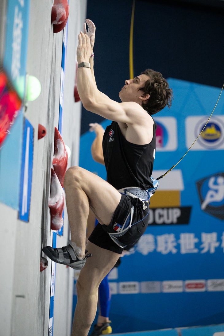 Current world record speed climber Sam Watson wearing the Evolve Defy in a competition.