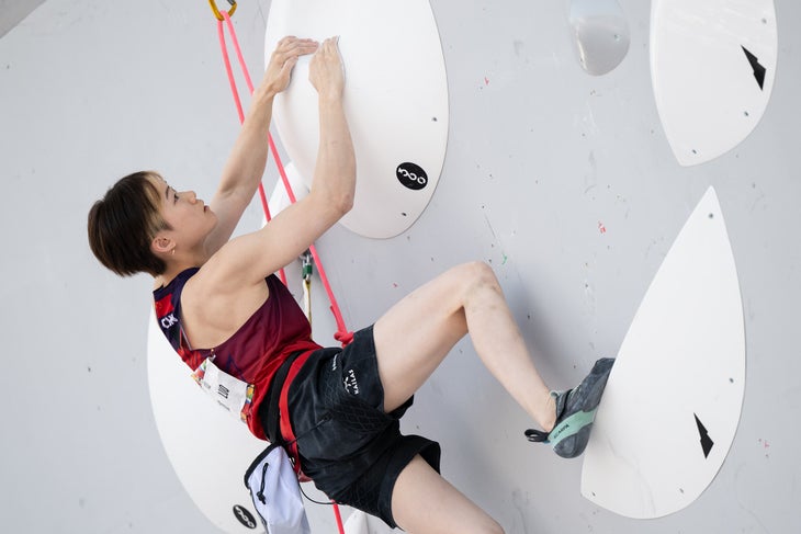 A chinese olympian wearing a pair of Scarpa's Women's Instinct VS climbing shoes.