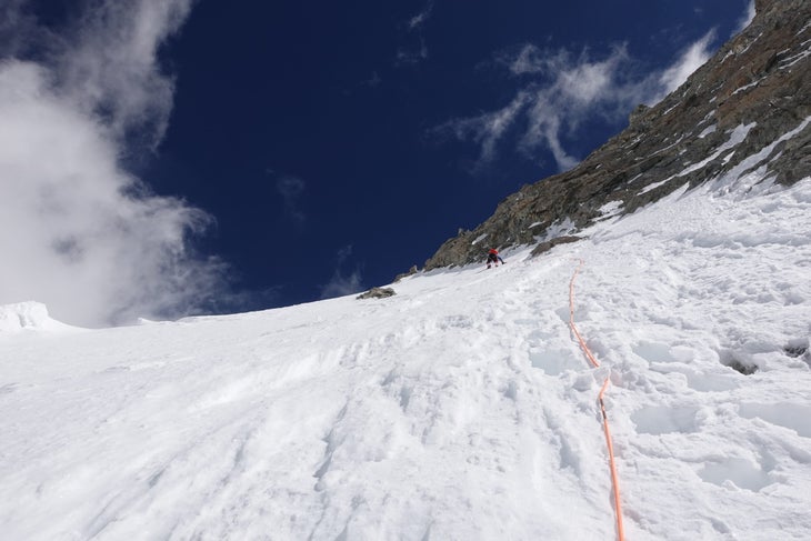A climber incredibly run out on a snow slope on the west ridge of Gasherbrum III.