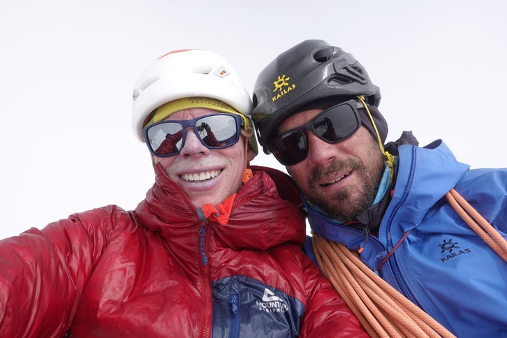 A selfie of Tom Livingstone and Aleš Česen in a whiteout at the top of Gasherbrum III