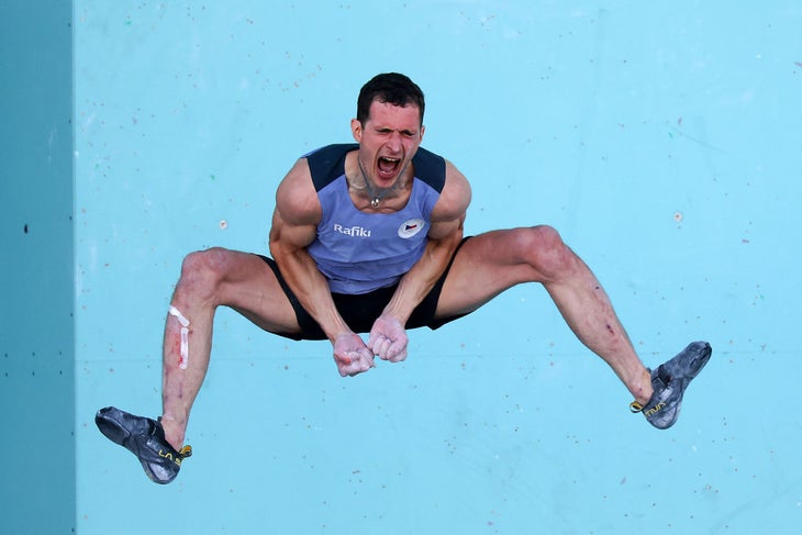 Adam Ondra of Team Czechia celebrates while falling after his climb during the Men's Boulder & Lead Semifinal on day ten of the Olympic Games Paris 2024 at Le Bourget Sport Climbing Venue on August 05, 2024 in Paris, France.