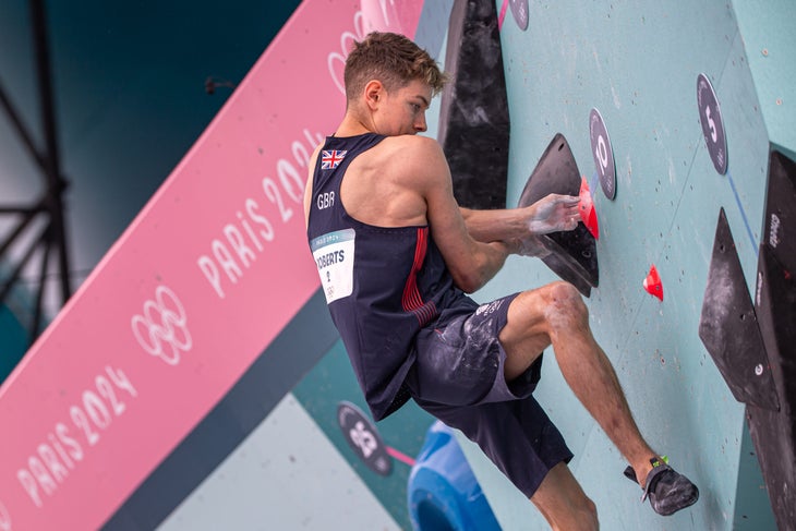 Toby Roberts crossed up on double underclings near the top of problem 3 in the Men's Olympic Boulder final