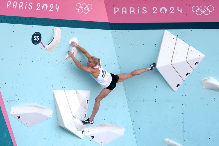 Janja Garnbret demonstrating tension and flexibility on the top of problem #3 in the bouldering semifinal.