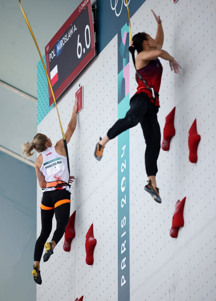 An image of both Miroslaw and Deng leaping for the finish buzzer in the Olympic Speed final.