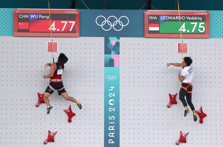 Two climbers hitting the speed buzzer at the same time in the fastest Speed climbing race that has ever been run.