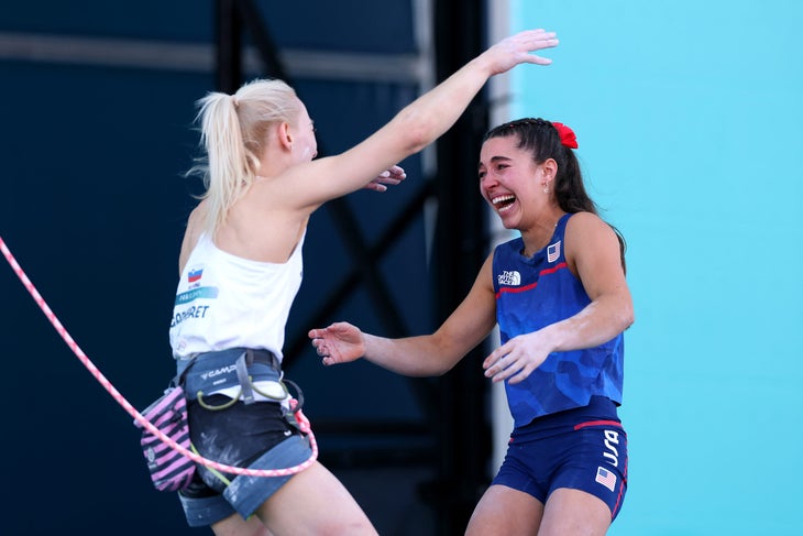 Brooke Raboutou (in tears) giving Janja Garnbret (still roped up) a hug after learning that they'll stand together on the Olympic podium