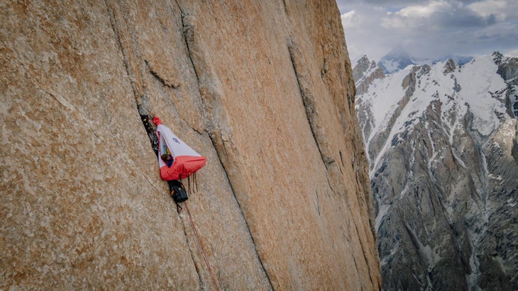 Climber lays in portaledge during ascent of Eternal Flame, Nameless Tower, Pakistan.